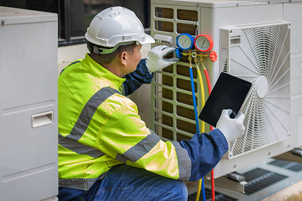 Professional Hvac technician working in Puryear, TN